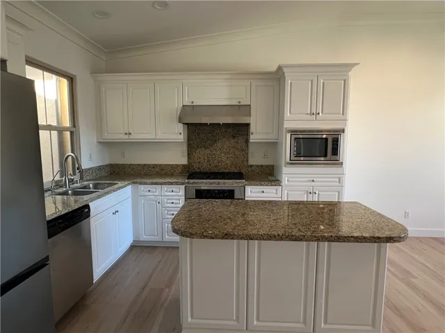 from stairway to view the kitchen
