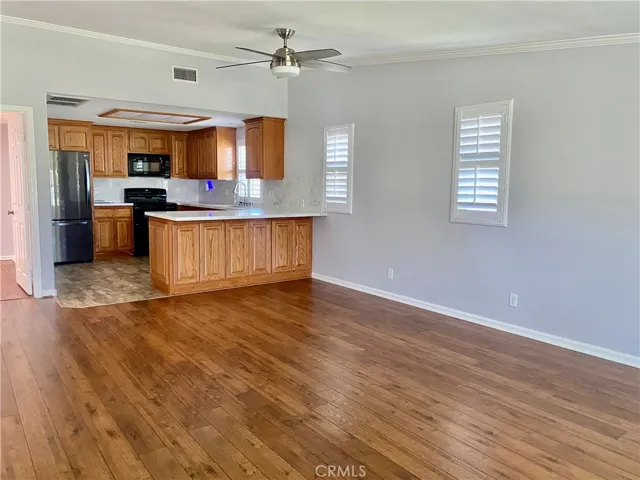 LOOKING FROM THE ENTRY WAY TOWARDS THE KITCHEN