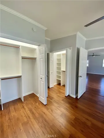 HIS AND HERS CLOSETS IN THE MAIN BEDROOM W/LIGHTS