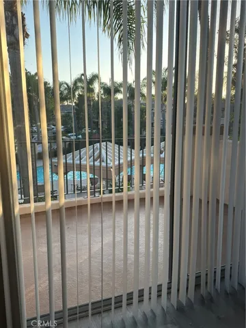 View of pool from familyroom / balcony