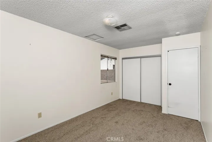 Back bedroom with new carpet.