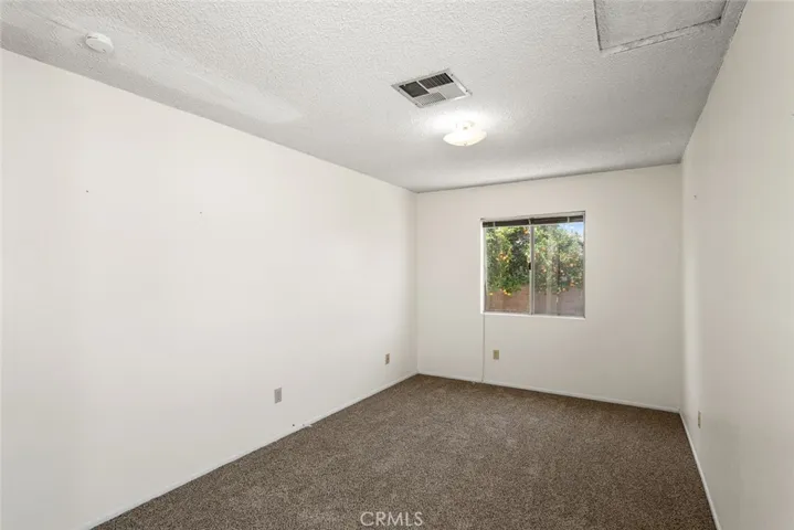 Back bedroom with new carpet.