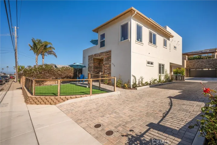 Driveway to two car garage plus 1 designated off street parking space