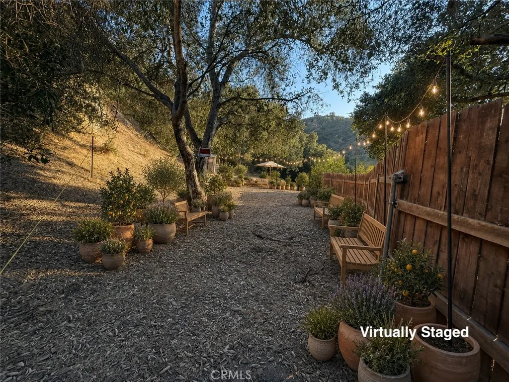 Back of property behind fencing in back of house - Virtually Staged