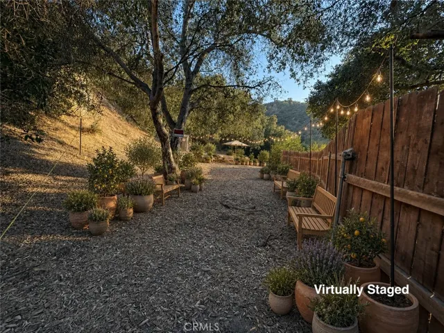 Back of property behind fencing in back of house - Virtually Staged