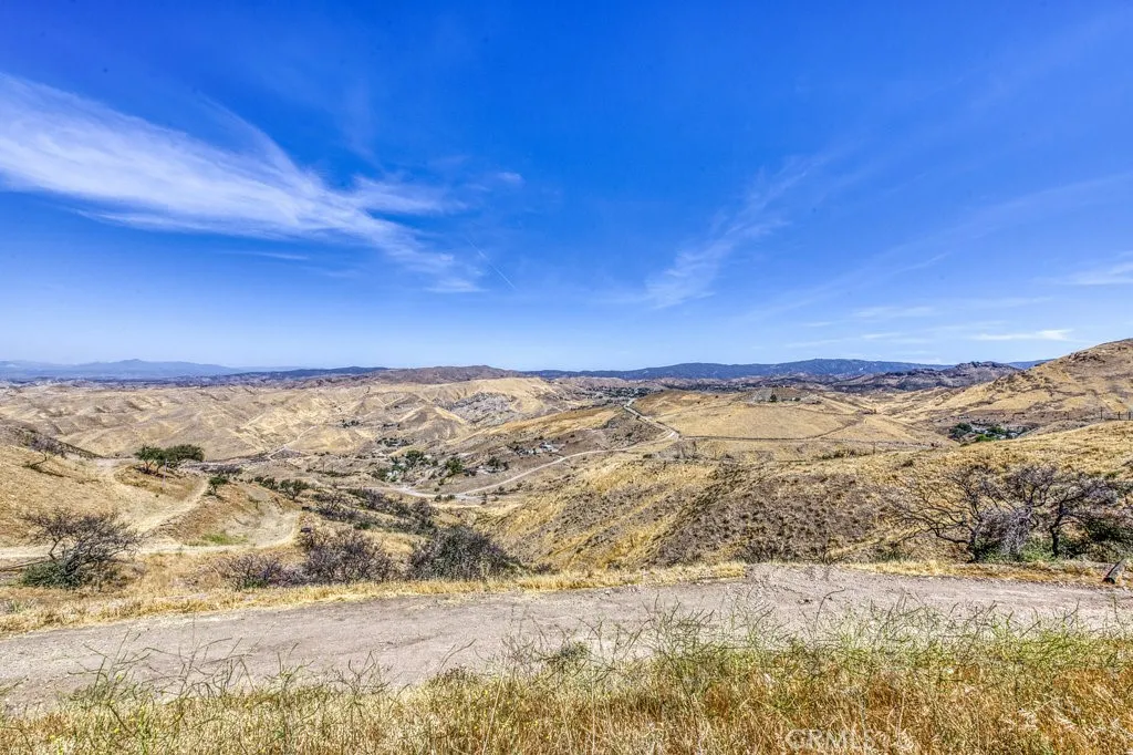 VEIW OF THE SIDE DRIVEWAY. OUTSTANDING VIEWS ON TOP OF THE WORLD