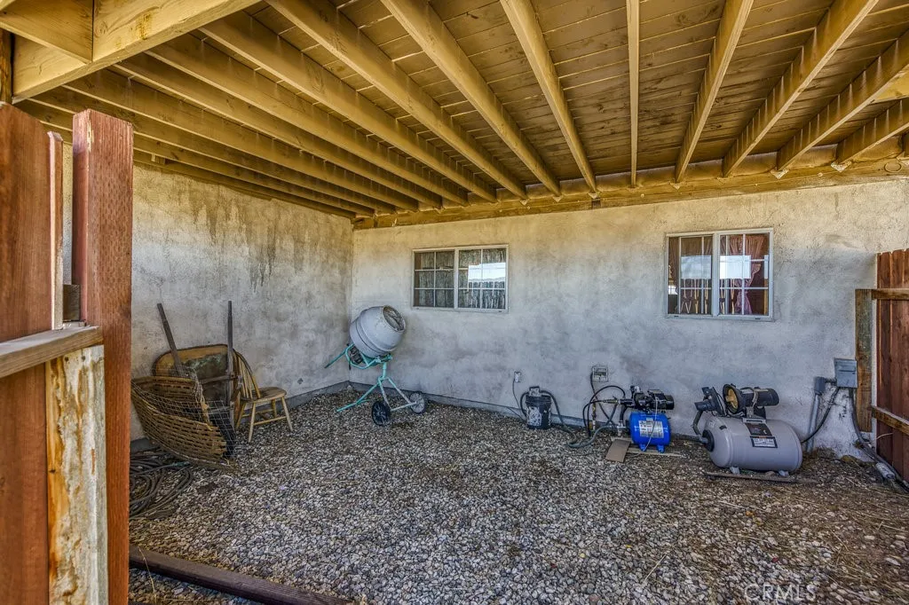 GATED STORAGE SPACE ON THE SIDE OF THE HOUSE
