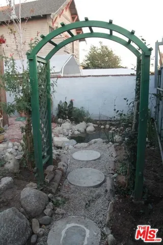 trellis walkway to pond
