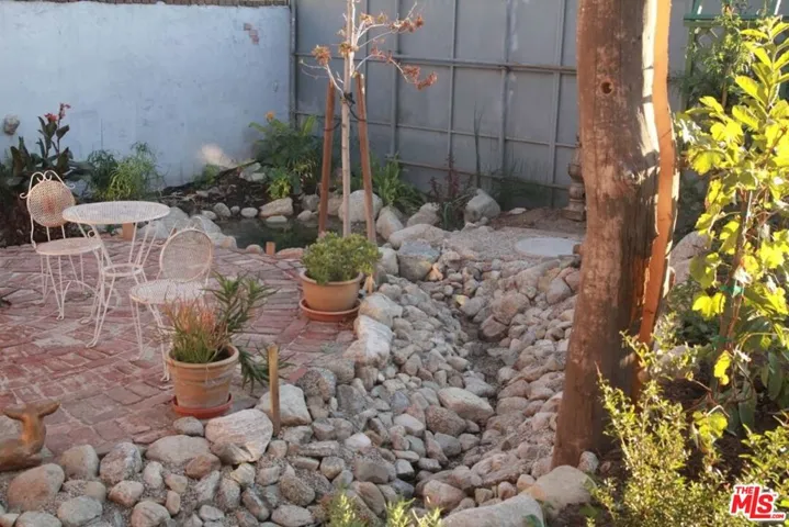 dry streambed to pond