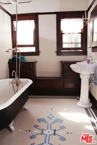 Decorative floor tile and claw