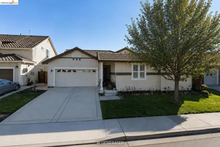Single-story residence featuring a tile roof and a two-car garage with decorative window inserts