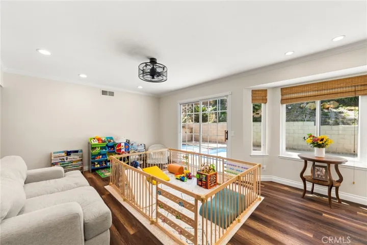 2nd family/living room set up as a playroom- access to backyard and awesome windows! This could also be a formal dining room