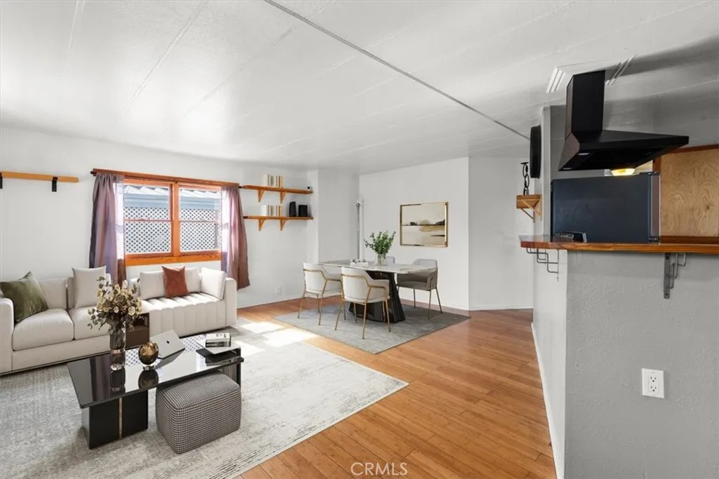 The virtually staged living and family room showcase the home’s warm, open feel and flexible layout.