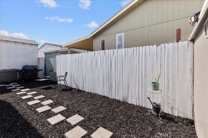 Private patio with fenced yard