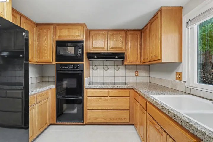 Wood-finish cabinetry paired with light-colored countertops