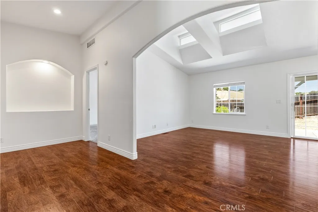 Your view when you walk in front door huge archway to living room and backyard view