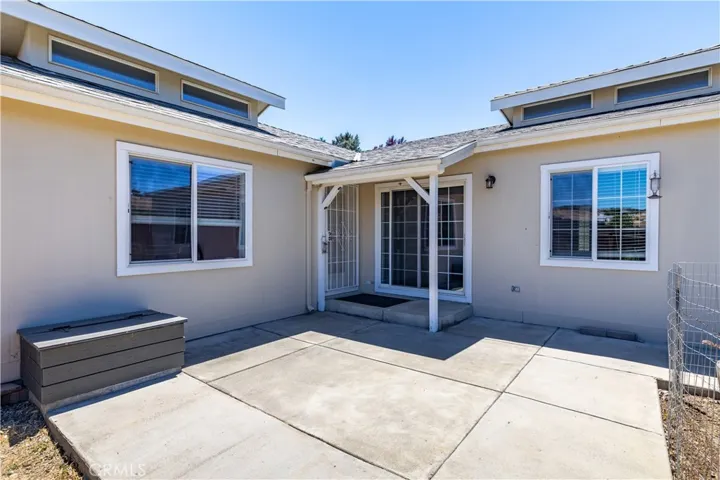 Large backyard patio with door off kitchen and living room access
