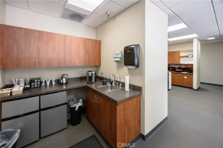Upper-level kitchenette with open-concept layout.
