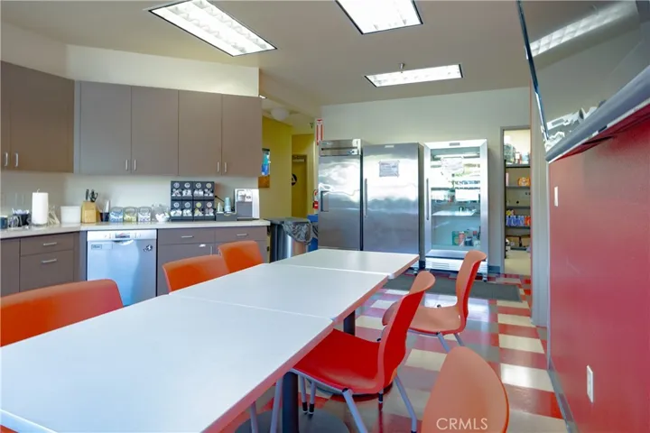 Another view of the kitchen with a supply room in the rear