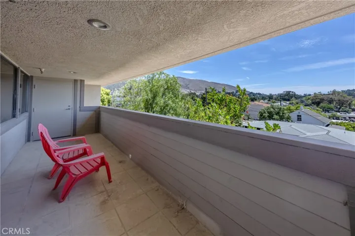One of two upper-level balconies featuring beautiful scenic views, accessible via two corner offices.