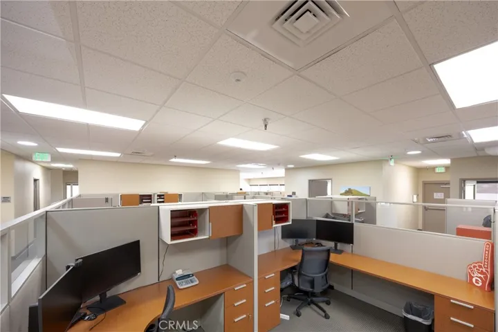 Upper-level mid-office workstation area featuring a spacious, open-concept layout.