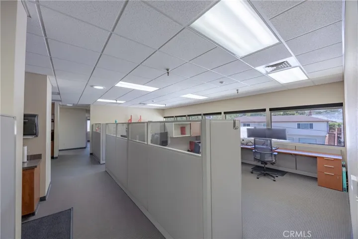 Upper-level workspace with open-concept copy room to the left