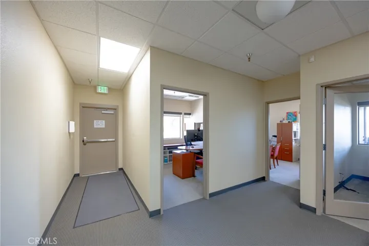 Spacious professional layout featuring three private offices and direct access to an exterior stairway.