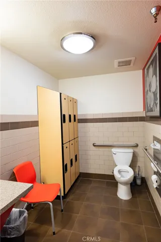 Full bathroom with storage lockers for personal use.