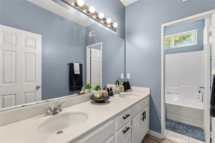Hall bath w/ dual sinks.