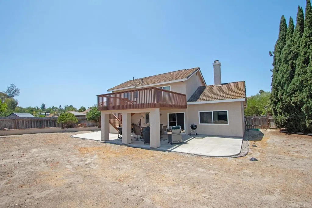 Balcony has stairs to backyard