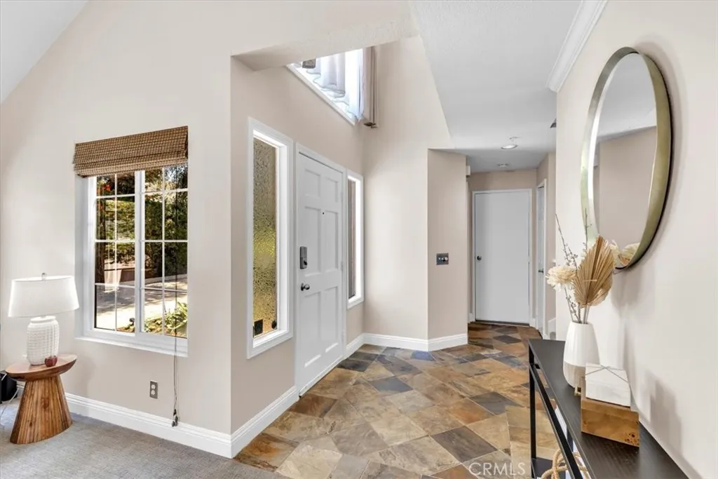 Proper foyer with custom slate floors...because who has time to stress over sensitive flooring?