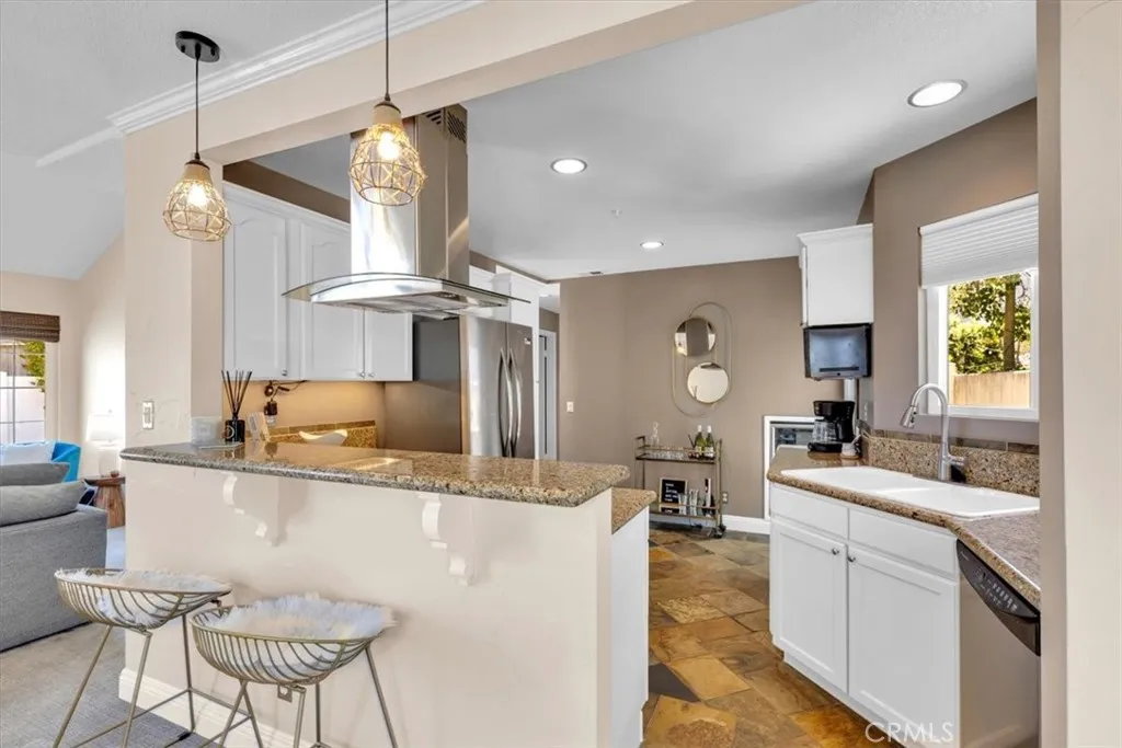 Breakfast counter for the coffee crowd, French doors for the patio crowd. Everybody wins.