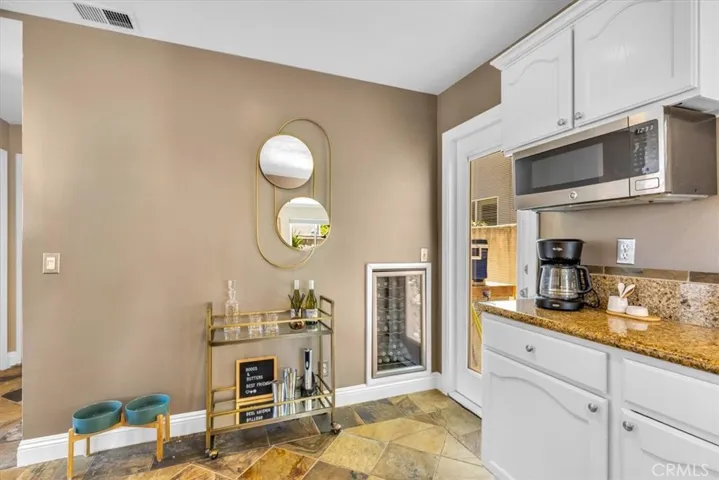 Wine fridge included, no judgment on how full you keep it.