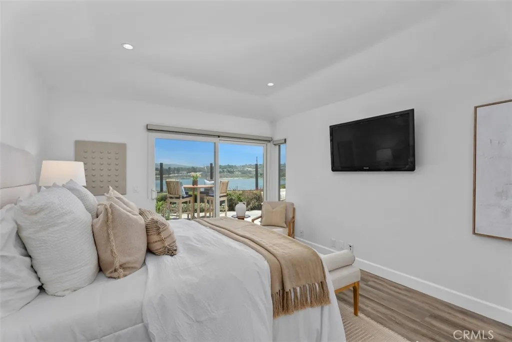Primary main floor bedroom with bay view