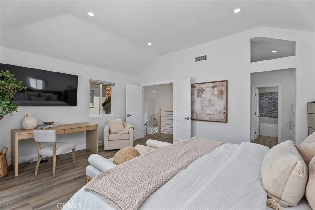Primary master bedroom large enough for desk area and seating