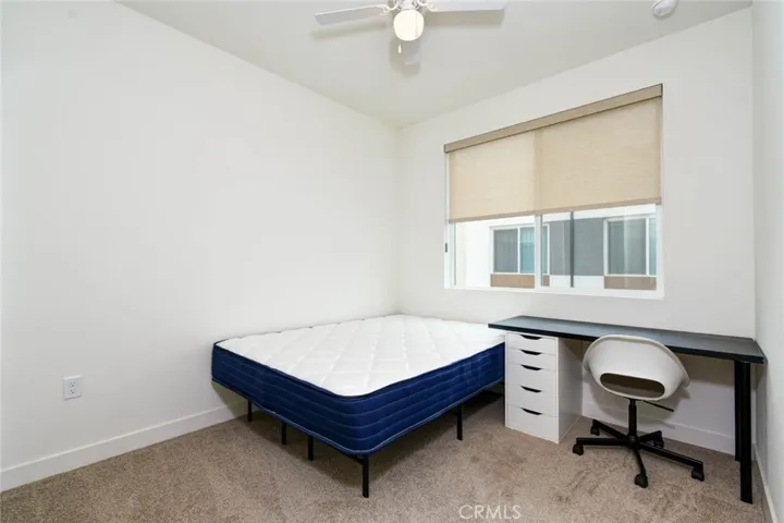 The 2nd bedroom on the 3rd floor was furnished with bed and desk.