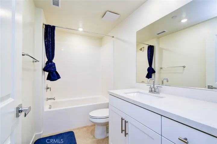 The hall way bathroom is a full bathroom with single vanity and shower/tub combo for the secondary bedrooms,