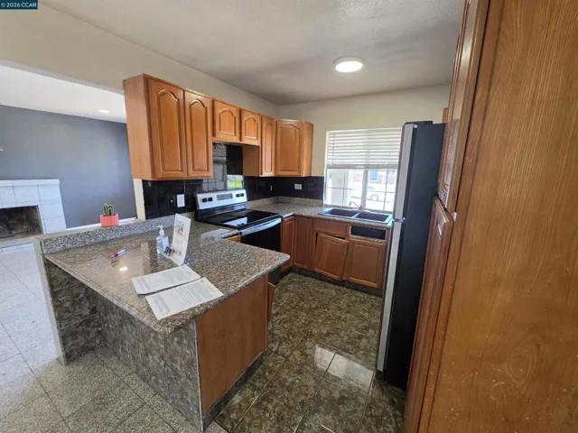Kitchen with a place to sit and eat.