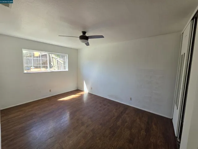 View of bedroom 2 from the door. The window overlooks the backyard.