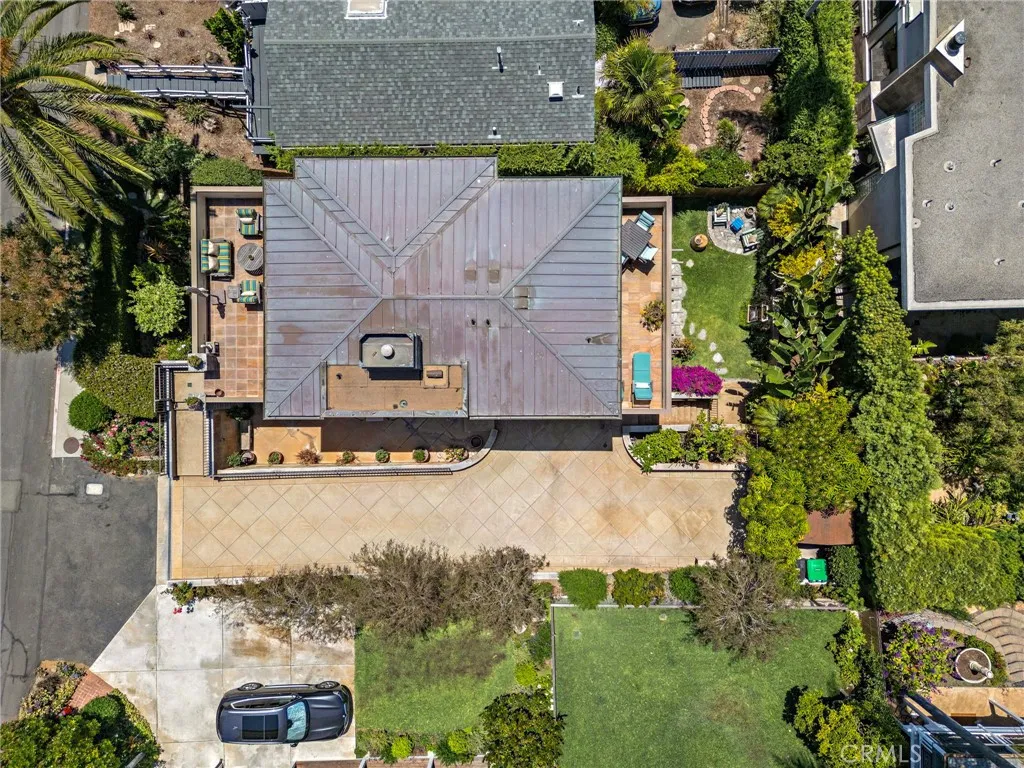 Aerial shot of the property shows the oversized driveway with parking for five cars in addition to the attached two-car garage.