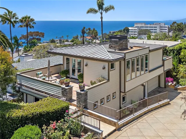 Perched above South Laguna's coastline just moments from Thousand Steps Beach, this custom Craftsman-style home embraces the best of Southern California coastal living.