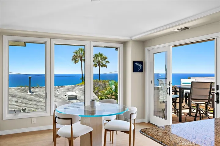 Dining area located off the living room and kitchen, with french doors leading to the second ocean view deck.