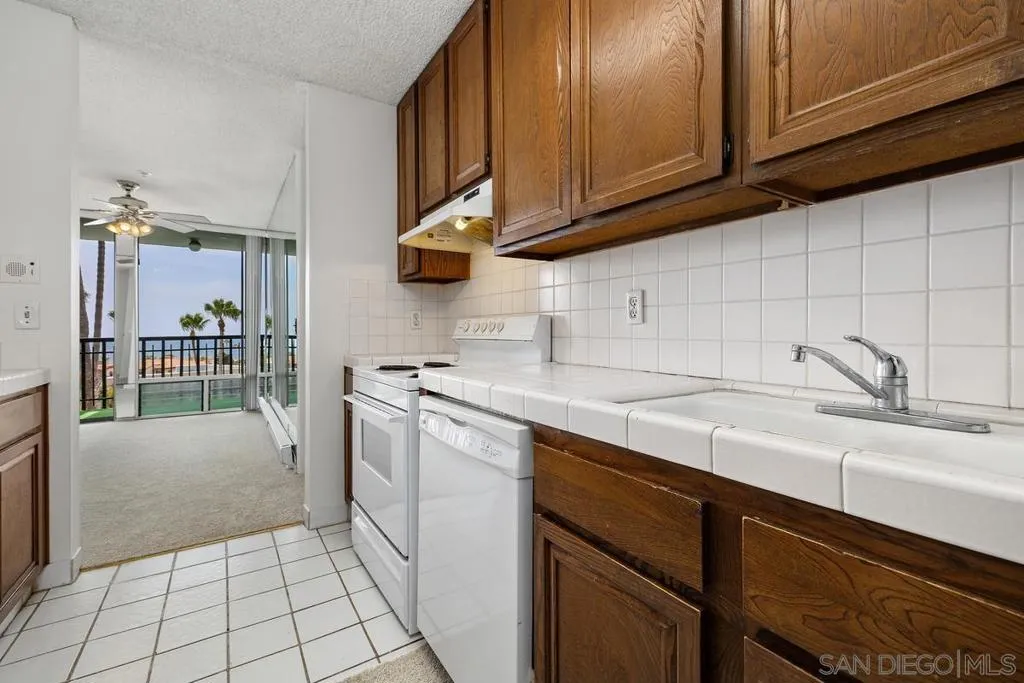 Looking back through the kitchen to the dining area out the balcony with those GREAT ocean views!!!