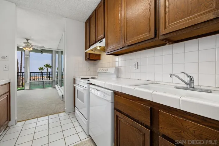 Looking back through the kitchen to the dining area out the balcony with those GREAT ocean views!!!
