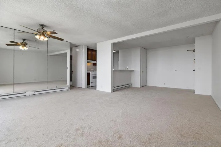 Looking back across the huge living room and dining area to the kitchen.