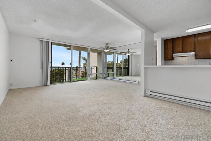 Entering the home, looking across the huge living room, you will be immediately be drawn to the balcony with ocean views!!!