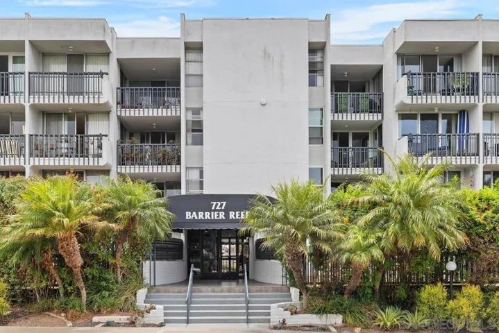 The 4 story Barrier Reef building is located across the street from the Tourmaline Surf Park beach access.