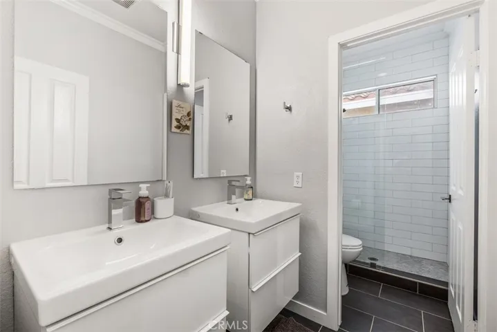 This is a view of the remodeled secondary bathroom complete with upgraded tiled shower