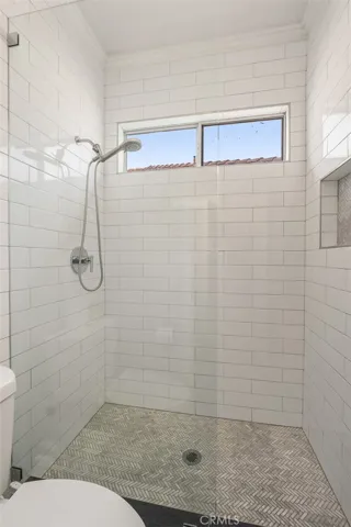 Here is a closer look at the tiled shower in the secondary bathroom