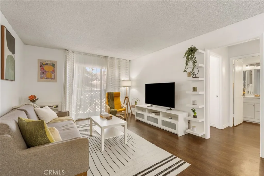 Living area leading towards the balcony and bathroom